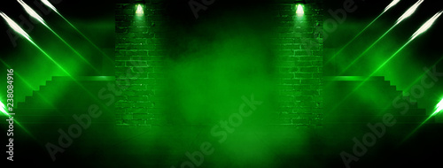 Background of an empty room with brick walls, stairs, illuminated by green neon light, laser beams