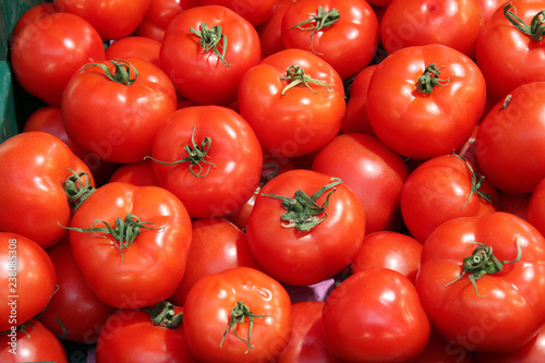 Group of fresh red healthy tomatoes use as food and vegetables background. Healthy food concept