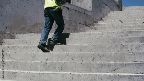 Low angle view of construction workers exit stairs - slow motion 2