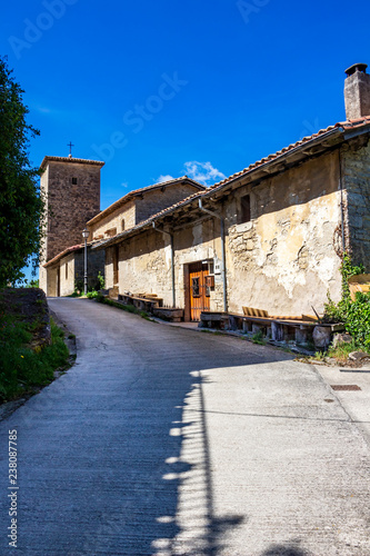 Street view of Iroz or Irotz in Navarre, Spain on the Way of St. James, Camino de Santiago, St. Peter's Church in the background
