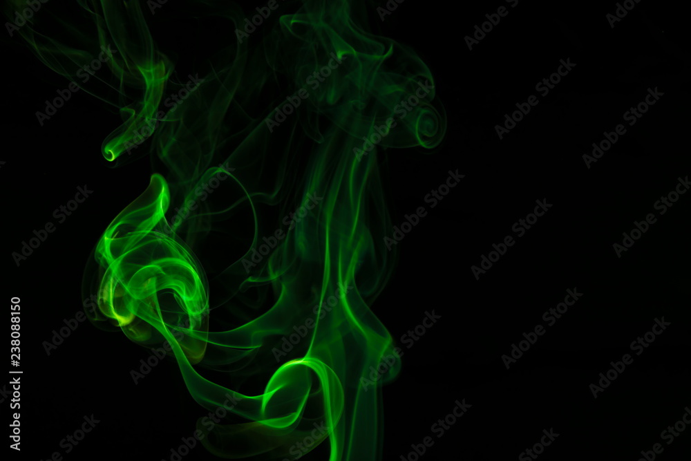 Green smoke on black background Green smoke on black background