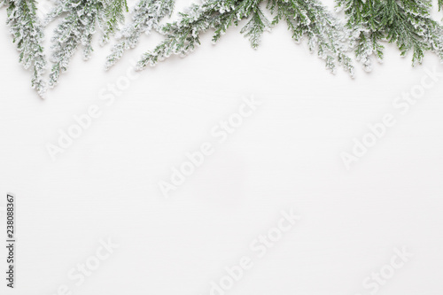 Christmas white Fir tree branches with stars decorations.