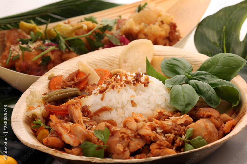 various street food with chicken wings on rustic background. balinese nasi campur and indian and brasilian street food. various street food with chicken wings on rustic background. balinese nasi campur and indian and brasilian street food.