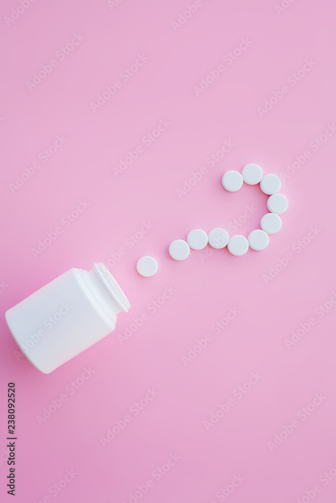 Close up of pills. Dietary supplements. Variety pills. Vitamin capsules on pink background Close up of pills. Dietary supplements. Variety pills. Vitamin capsules on pink background