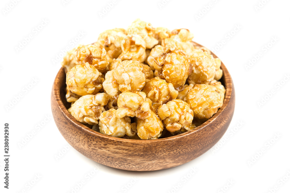 Handfuls of caramel popped popcorn kernels Handfuls of caramel popped popcorn kernels