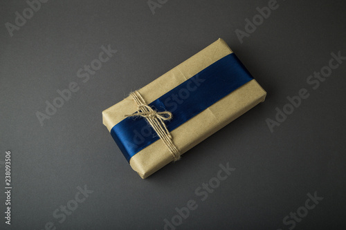 Gift box on a dark background. Top view with place for text