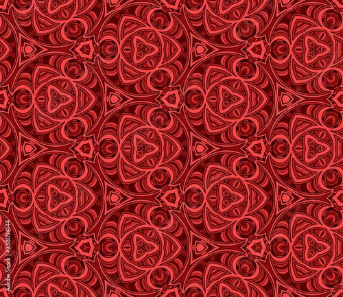Seamless hexagonal pattern from circular abstract geometrical ornaments multicolored in red shades on a dark background. Vector illustration. Suitable for fabric, wallpaper and wrapping paper