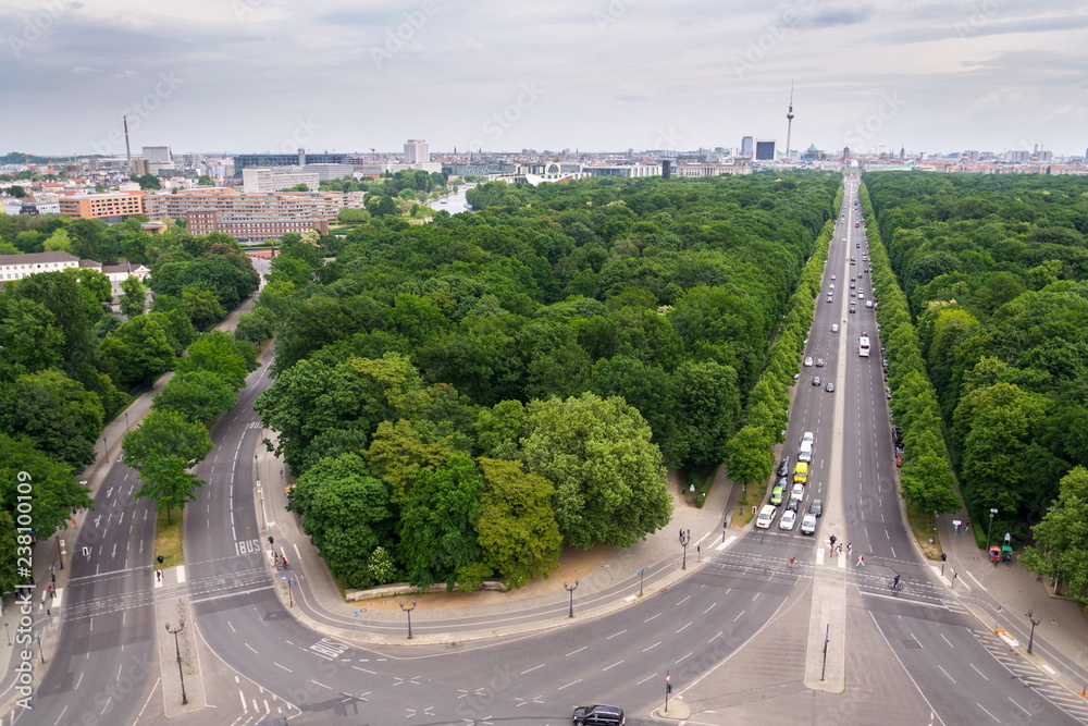 Berlin summer skyline aerial view of  Brandenburger Tor - Brandeburg gate and television tower Fernsehturm with cars passing crossroad under Victory Column in Tiergarten, Berlin, Germany