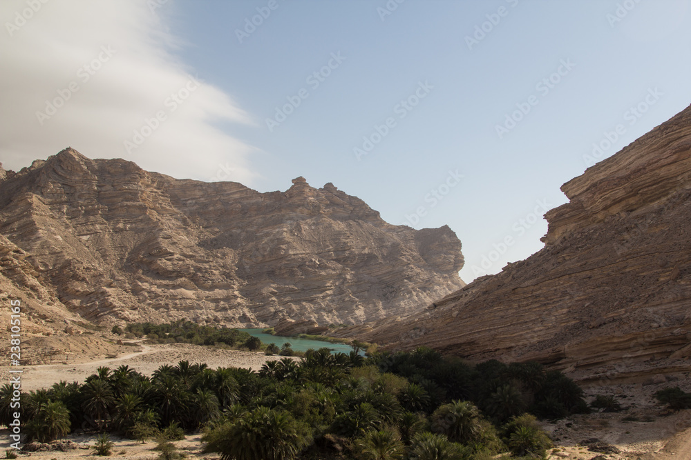 A scenic wadi in the eastern region of the Dhofar mountains during a road trip through the Sultanate of Oman, a perfect travel destination for off road enthusiasts