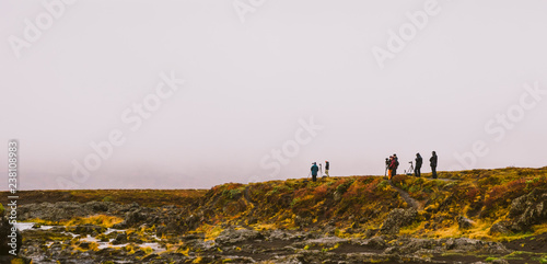 Group of photographers on a mountain photo