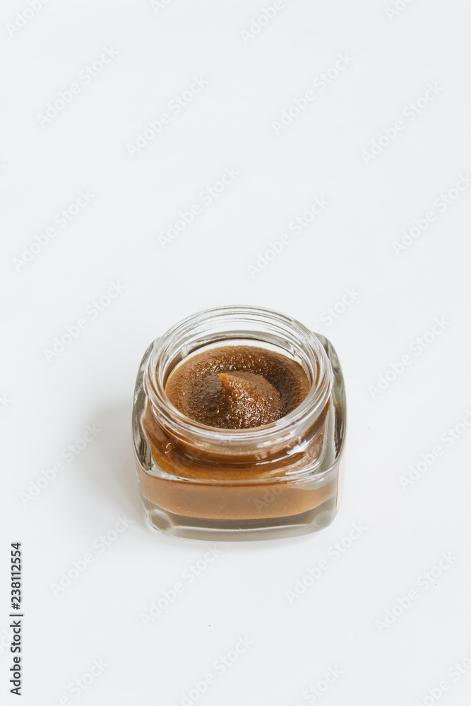 Chocolate cream in small jar on white background Chocolate cream in small jar on white background