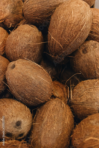 Pile of coconuts, tropical fruits background