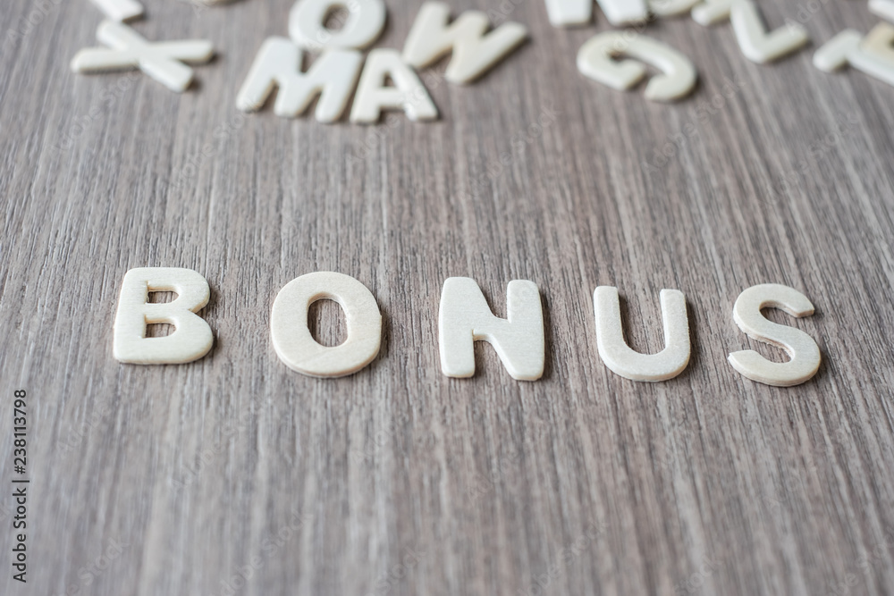 BONUS word of wooden alphabet letters. Business and Idea concept BONUS word of wooden alphabet letters. Business and Idea concept
