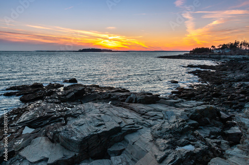A vibrant sunset above the rocky coast of Maine. 