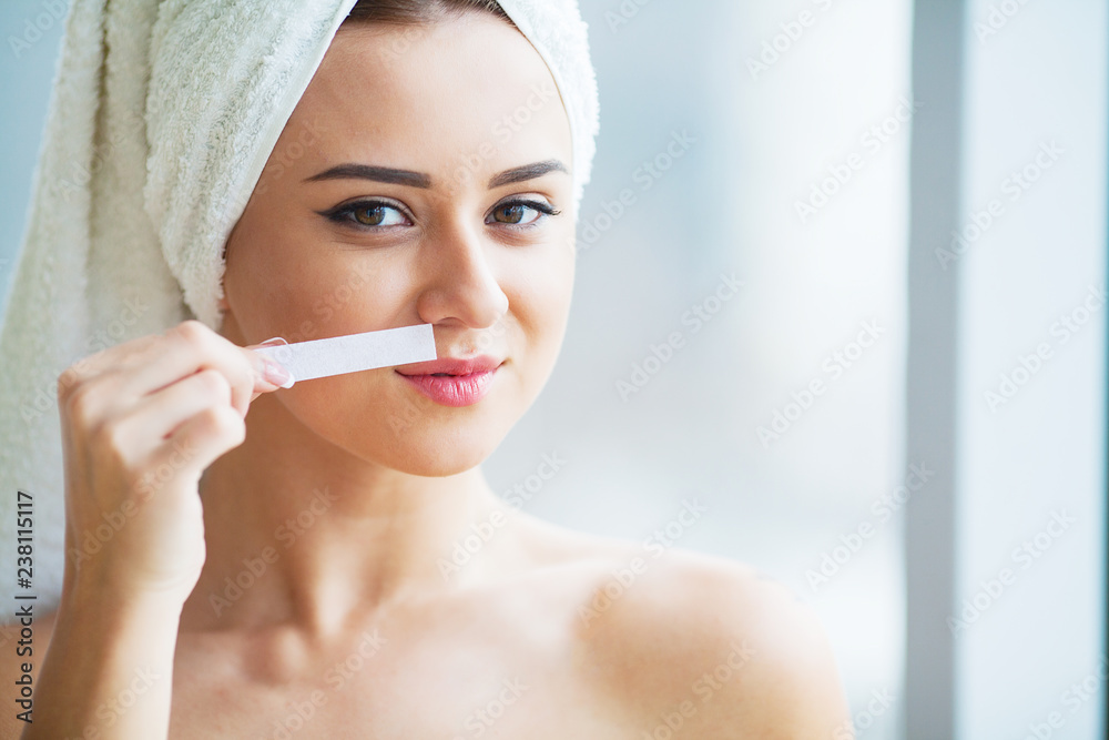 Hair Removal Wax. Young woman reciving facial epilation Hair Removal Wax. Young woman reciving facial epilation
