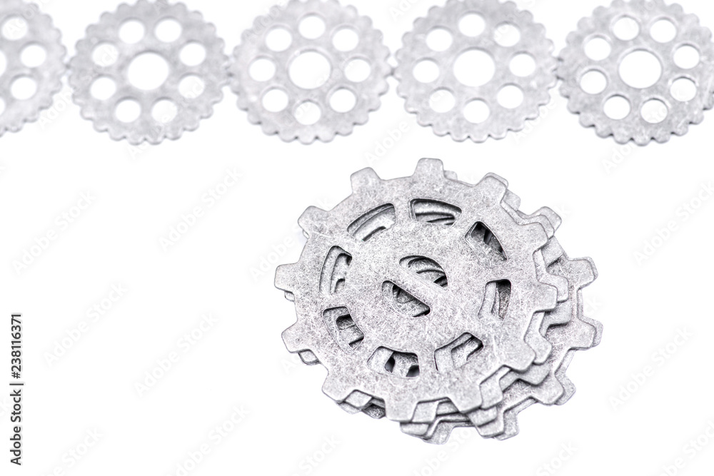 Old vintage antique hour metal gears, cogwheels isolated on white background
