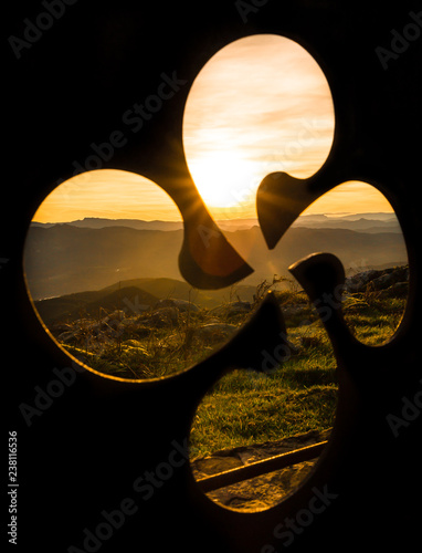 Basque symbol under a sunset, Basque Country, Spain photo