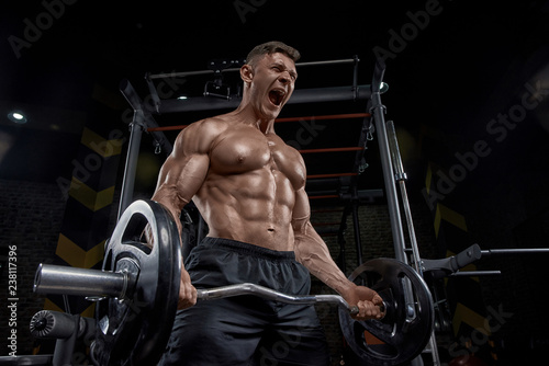 Muscular man working out in...