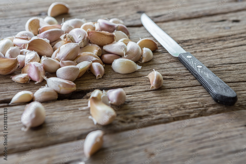 Garlic cloves and knife Garlic cloves and knife