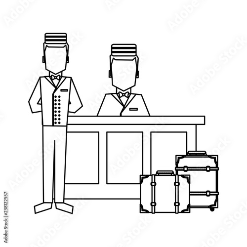 Bellboy with luggage at reception black and white