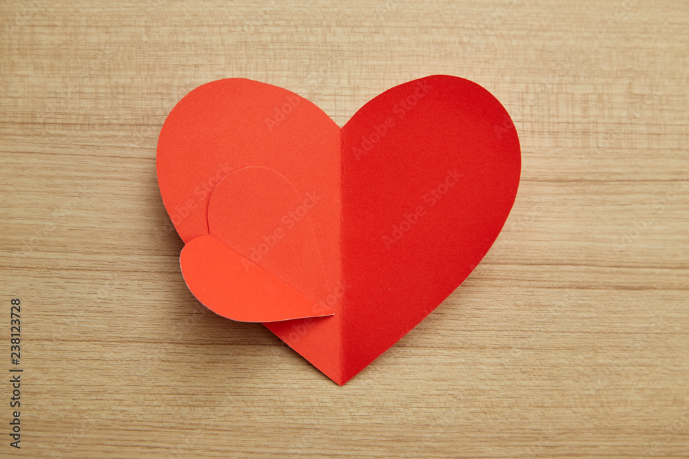 Valentine's day red paper heart on wooden Valentine's day red paper heart on wooden