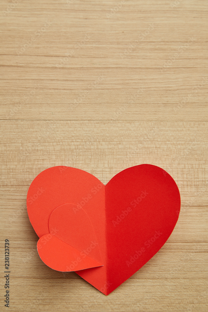 Valentine's day red paper heart on wooden Valentine's day red paper heart on wooden