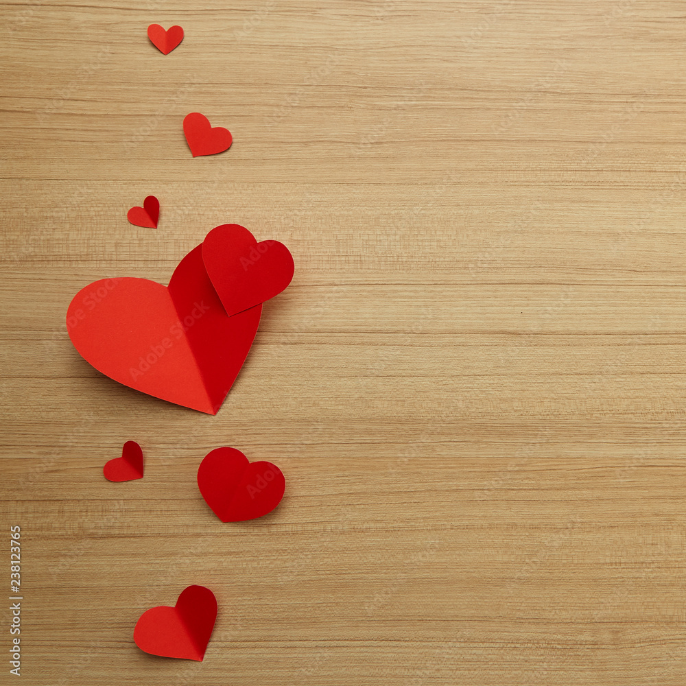 Fototapeta premium Valentine's day red paper heart on wooden