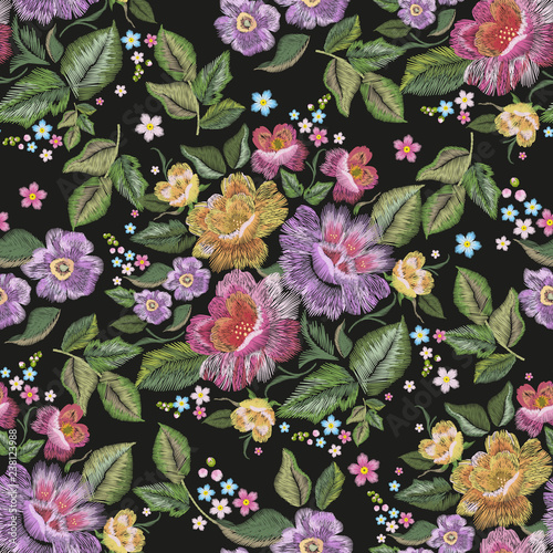 Embroidery floral traditional seamless pattern with pansies and roses. Vector embroidered bouquet with flowers for wearing design.