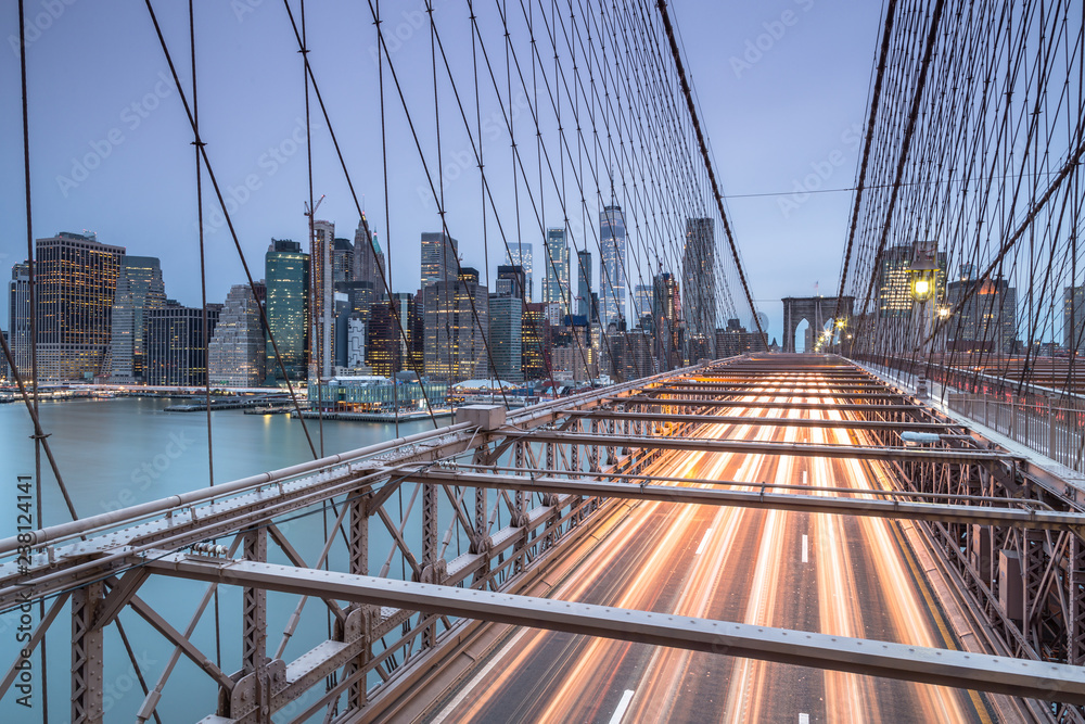 Naklejka premium Brooklyn bridge view at sunrise with long exposure
