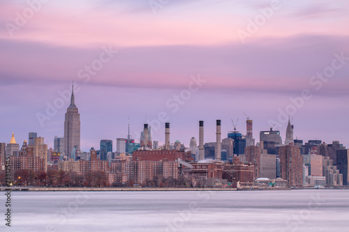 View on Midtown Manhattan from east river at sunrise with long exposure