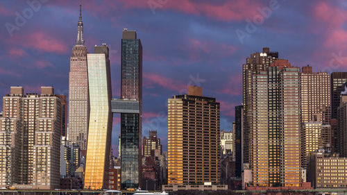 Canvas Print View on Midtown Manhattan  from east river at sunrise with long exposure