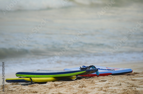 Grouping of 3 boogie boards on Waimanalo Beach in Oahu, Hawaii