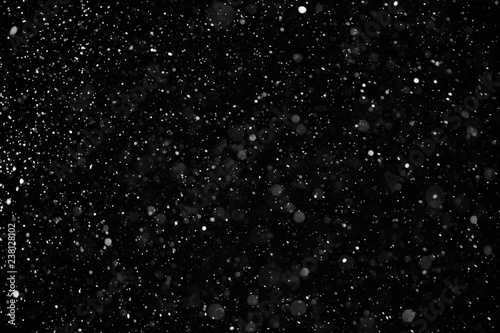 Falling down real snowflakes from left to right  calm snow  shot on black background  matte  wide angle  isolated  perfect for digital composition  post-production