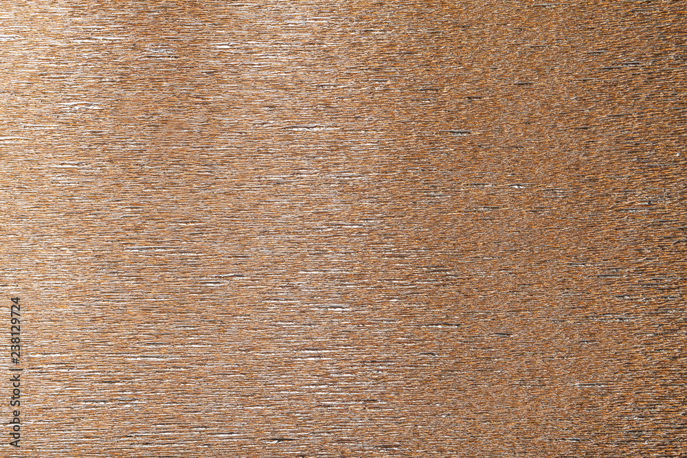 Textural of bronze background of wavy corrugated paper, closeup. Textural of bronze background of wavy corrugated paper, closeup.