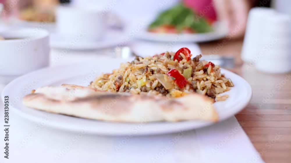Pilaf in a plate close-up. Street Cafe. 4k Pilaf in a plate close-up. Street Cafe. 4k