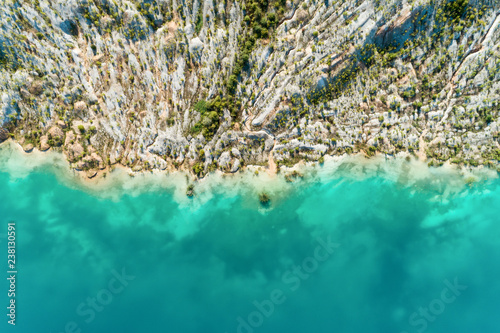 The shores of the mountain lake, the blue water in the lake. Aerial view, from top to bottom