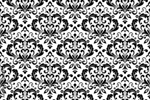 Wallpaper in the style of Baroque. Seamless vector background. White and black floral ornament. Graphic pattern for fabric, wallpaper, packaging. Ornate Damask flower ornament
