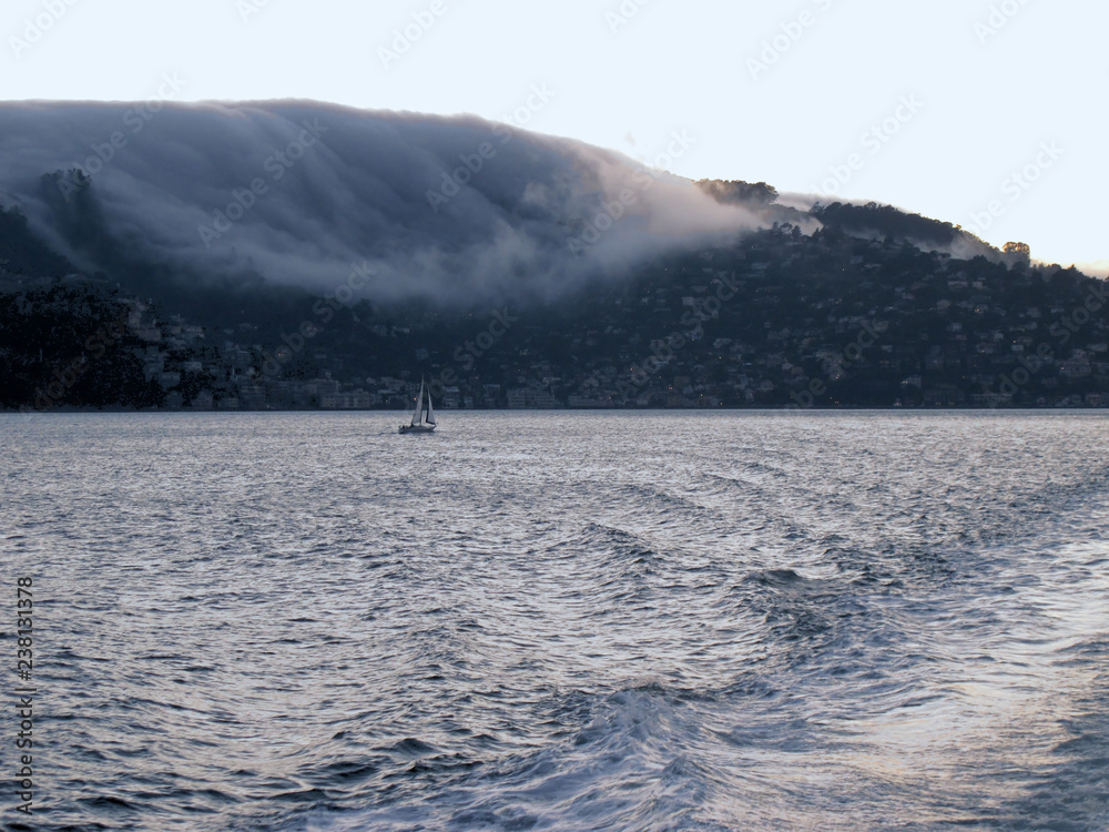 fog rolls into San Francisco Bay