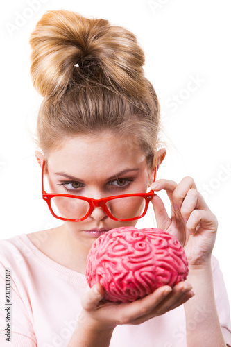 Funny silly woman holding human brain