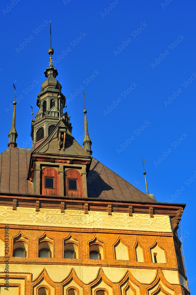 Fototapeta premium GDANSK, POLAND, DECEMBER 2, 2017. Tower of Old The prison tower with clear sky background. Now Amber Museum. Branch of the Historical Museum of the City of Gdansk