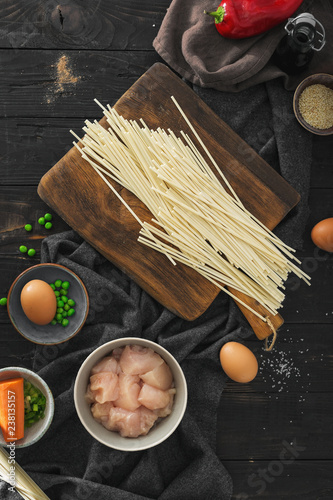 Top view raw ingredients cooking udon noodles chicken meat kitchen photo