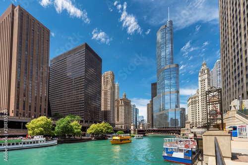 Chicago downtown and Chicago River with tourist ships during sunny day, Chicago, Illinois. 