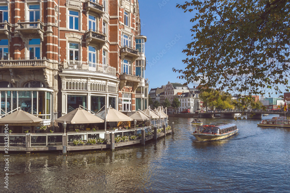 terrace of rastaurant with canal view in Amsterdam