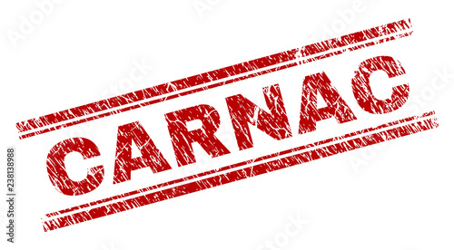 CARNAC seal stamp with corroded texture. Red vector rubber print of CARNAC caption with unclean texture. Text caption is placed between double parallel lines.