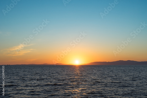 Seascape with beautiful sunset and sunset on the horizon.