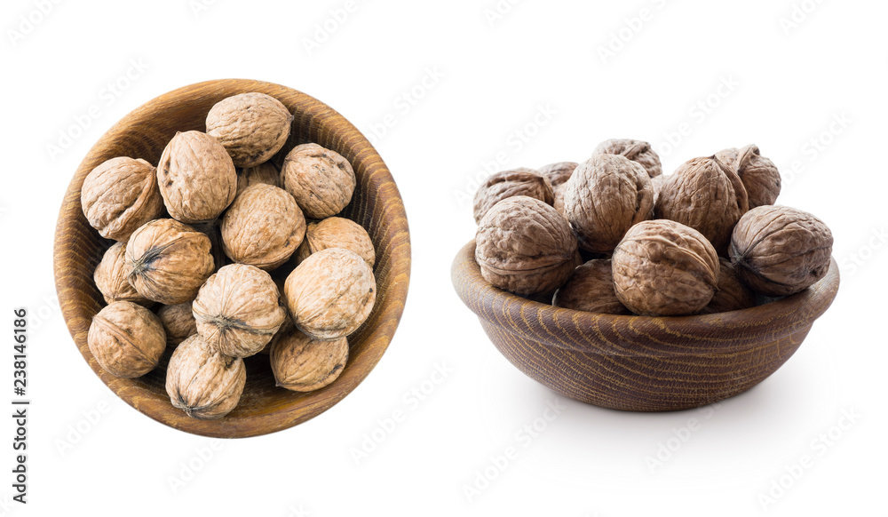 Walnuts isolated on white background. Heap of walnuts isolated on white background. Walnut in a wooden bowl on white background. Walnuts with copy space for text. Two bowls of nuts. Walnuts close-up. Walnuts isolated on white background. Heap of walnuts isolated on white background. Walnut in a wooden bowl on white background. Walnuts with copy space for text. Two bowls of nuts. Walnuts close-up.