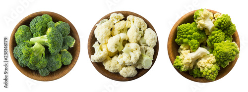Broccoli, cauliflower and roman cauliflower in wooden bowl isolated on a white background. Vegetables with copy space for text. Three bowls of cabbage on a white background. Set of cabbage. Top view. 
