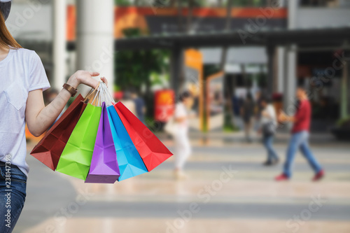 Concept of woman shopping and holding bags.