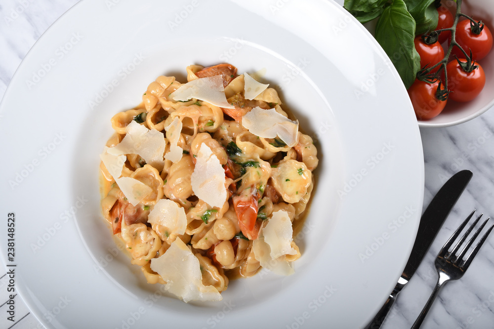 Gnocchi with fresh cherry tomatoes sauce, basil and Parmesan cheese Gnocchi with fresh cherry tomatoes sauce, basil and Parmesan cheese