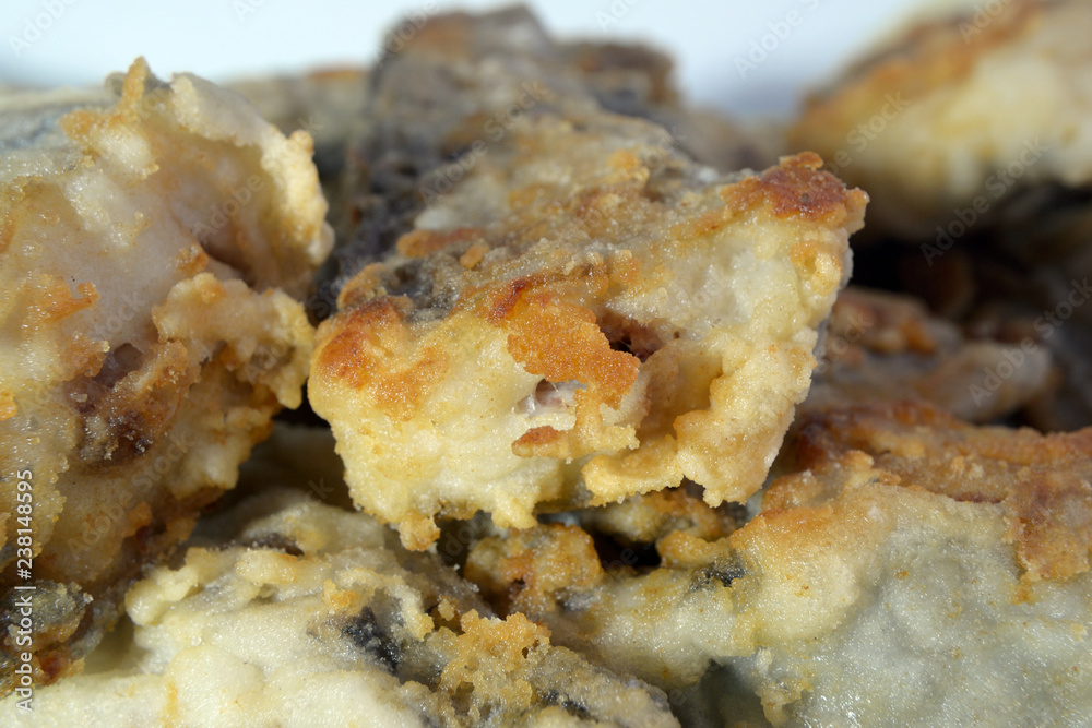 Slices of fish fried in batter close up Shallow depth of field Slices of fish fried in batter close up Shallow depth of field
